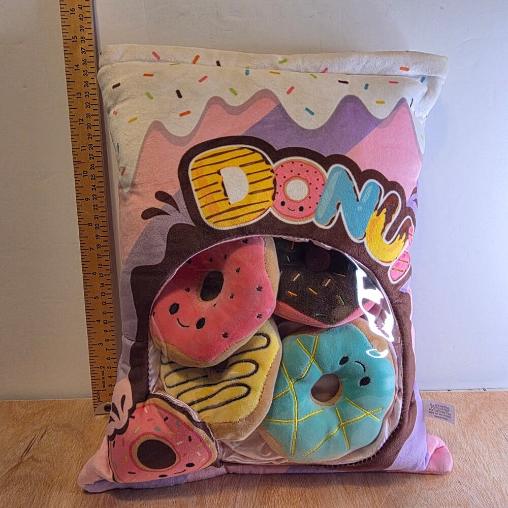 Fluffy Plush Donut Bag filled with four colorful plush smiling donuts